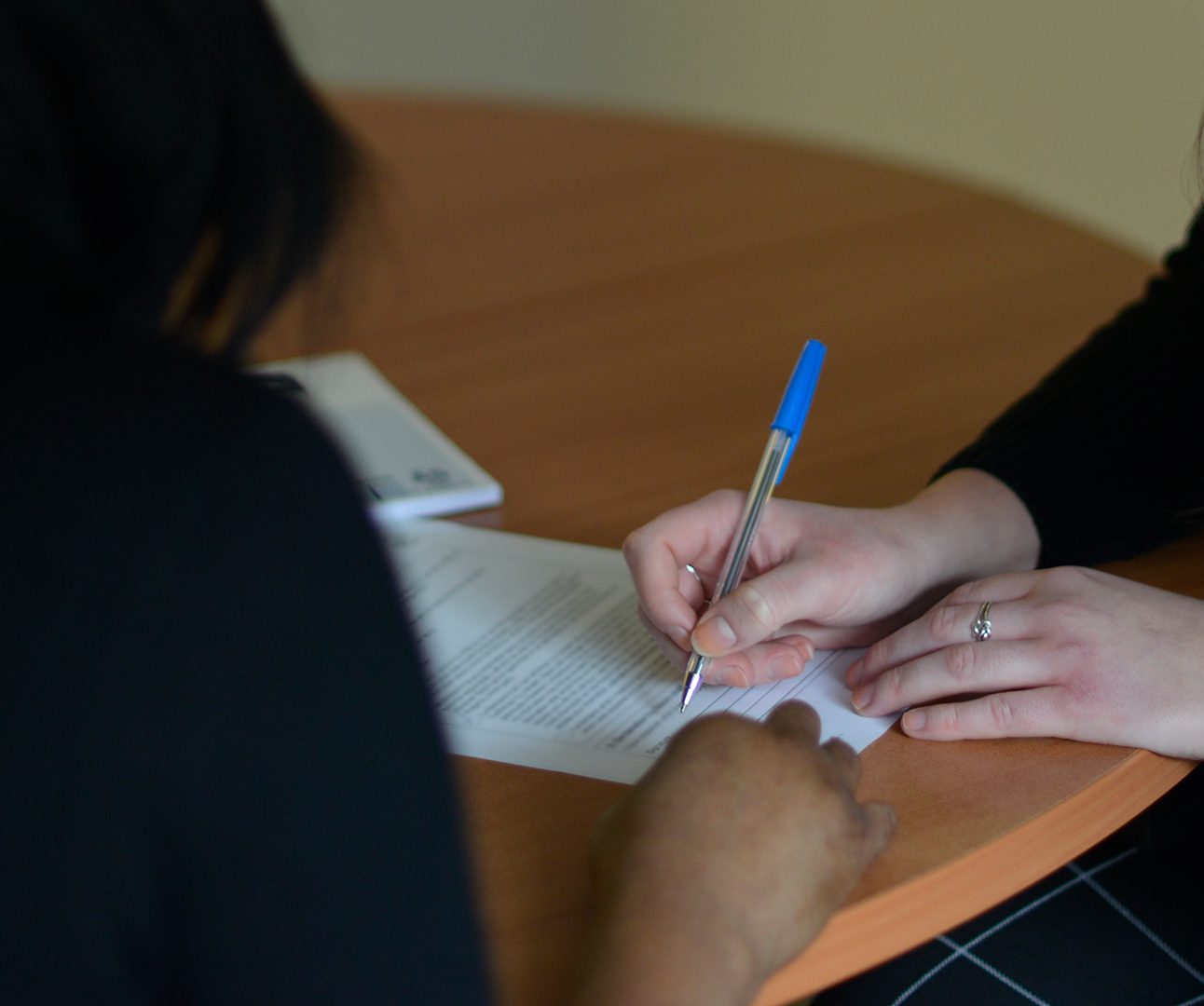 image of a criminal record support worker helping with paperwork