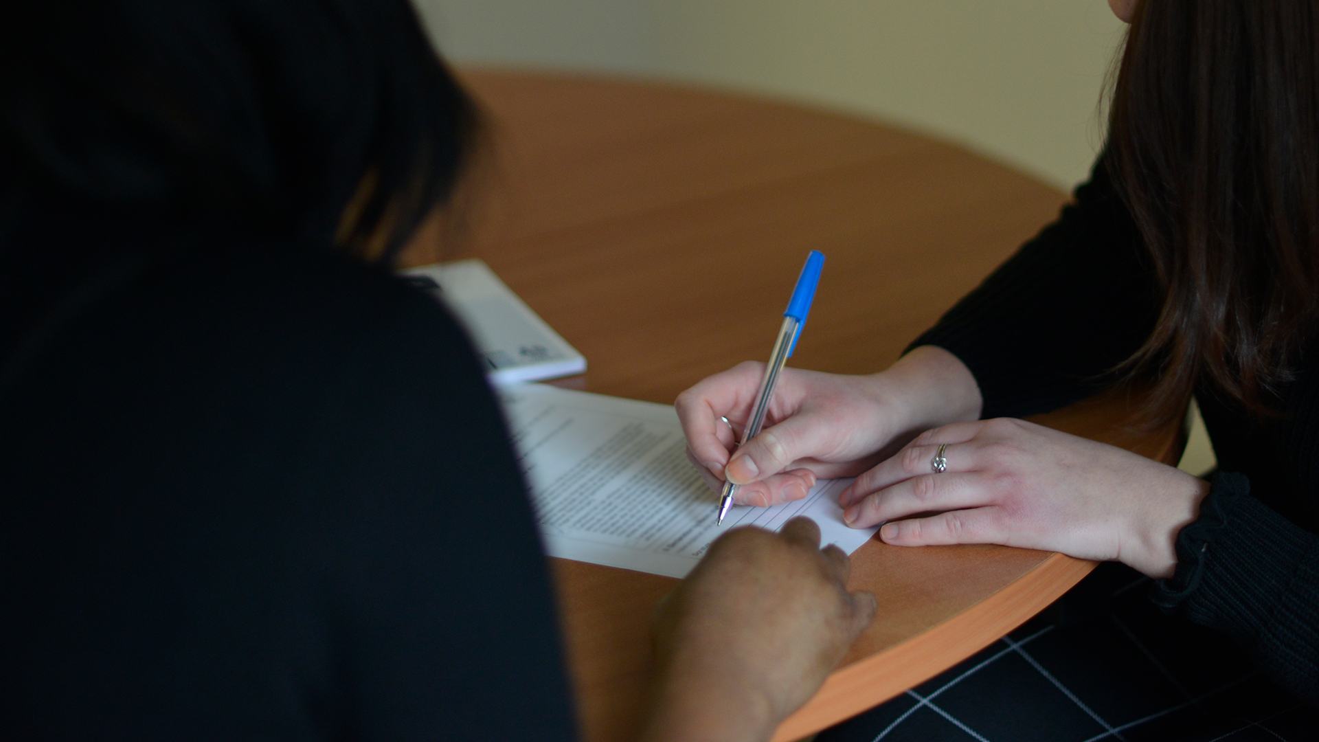 image of a criminal record support worker helping with paperwork