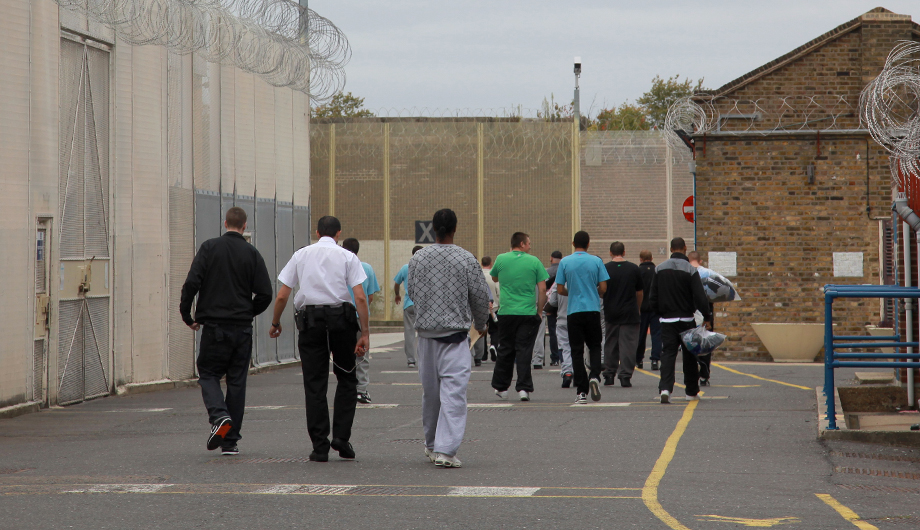 People walking into the prison gates